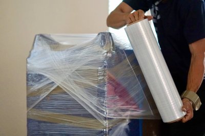 furniture-being-wrapped-in-plastic-before-moving-a-2025-01-10-16-30-06-utc furniture-being-wrapped-in-plastic-before-moving-a-2025-01-10-16-30-06-utc